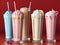Delicious Milkshakes of different flavors on a table