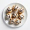 Delicious Miniature Profiteroles With Chocolate Sauce On A White Plate