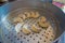 Delicious momo food over a metallic tray in the kitchen, type of South Asian dumpling native to Tibet, Nepal, Bhutan and