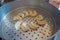 Delicious momo food over a metallic tray in the kitchen, type of South Asian dumpling native to Tibet, Nepal, Bhutan and