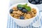 Delicious muesli with fresh blueberries, close-up, isolated