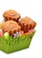 Delicious muffins, colorful caramels in the green basket