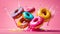 Delicious multi-colored donuts on a colored background cream snack concept
