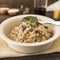 delicious mushroom risotto white bowl with spoon. High quality photo