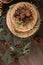 Delicious naked chocolate and hazelnuts cake on table rustic wood kitchen countertop. Top view. Flat lay