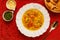 Delicious noodle soup with vegetables, noodle soup with vegetables, on a wooden background, red fabric background, with toast,