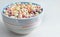 Delicious and nutritious colorful cereal with fruit favor in colorful bowl