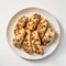 Delicious Olive And Almond Cookies With Nuts On A White Plate