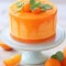 Delicious orange cake decorated with fresh mandarins, selective focus.