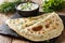 Delicious organic flat bread qutab stuffed with herbs served wit