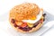 Delicious original american hamburger with grilled beef, egg and vegetables on white plate, snack or lunch, product photography fo