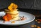 Delicious pancake stack with edible flowers