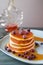 Delicious pancake stack with fresh blueberries and dripping maple syrup