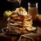 Delicious pancakes with apple and syrup