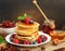 Delicious pancakes with berries and honey, jam