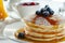 Delicious pancakes with fresh blueberries and honey drizzle for a mouthwatering breakfast