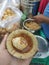 Delicious panipuri in hand beside the stall