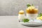 Delicious panna cotta with mango on grey table. Space for text