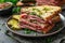 Delicious pastrami sandwich made with wholegrain bread with fresh salad and pickle