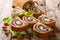 Delicious pastry poppy roll with raisins, nuts decorated with mint close-up on a table. horizontal