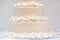 Delicious peach and white wedding cake