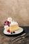 delicious piece of cake with whipped cream, fresh berries and tulips on plate