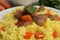 Delicious pilaf with meat and carrot on white plate