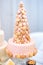 Delicious pink wedding cake decorated with macaroons
