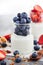 Delicious plain yogurt with fresh blueberry and strawberry in a