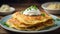 Delicious plate of golden brown potato pancakes with creamy sour cream