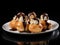 Delicious plate of profiteroles with whipped cream and chocolate sauce