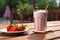 A delicious plate of strawberries and a refreshing glass of milkshake. AI Generated