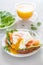 Delicious poached egg with salmon fish and orange juice