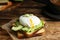 Delicious poached egg sandwich served on table