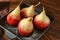 Delicious poached pears in red wine on pan
