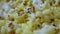 Delicious popcorn background. Macro shot of a popcorn texture of salted and unsalted corn