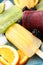 Delicious popsicle, ice cubes and fresh fruits on plate, closeup