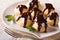 Delicious profiteroles with cream and chocolate glaze