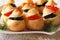 Delicious profiteroles stuffed with red and black caviar