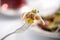 Delicious prosciutto titbit on a fork