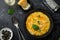 Delicious pumpkin risotto, black background