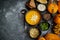 Delicious pumpkin soup with cream, seeds, bread and fresh herbs in elegant ceramic black bowl