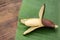 Delicious purple banana and fresh leaf on wooden table, closeup. Space for text