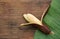 Delicious purple banana and fresh leaf on wooden table, top view. Space for text