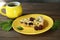 Delicious Quiche pie with cherry filling on yellow plate with cup of coffe