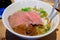 Delicious Ramen stew made from beef, noodles, chicken broth, mushrooms, corn . Served with traditional sauces