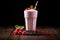 Delicious raspberry milkshake in a glass, perfect choice for a refreshing breakfast treat