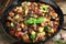 Delicious ratatouille in baking dish served on table, closeup