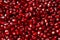 Delicious red ripe juicy pomegranate seed background texture.