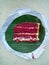 Delicious red velvet cake served on a plate made from banana leaf and recycled paper, magazine or phamplet